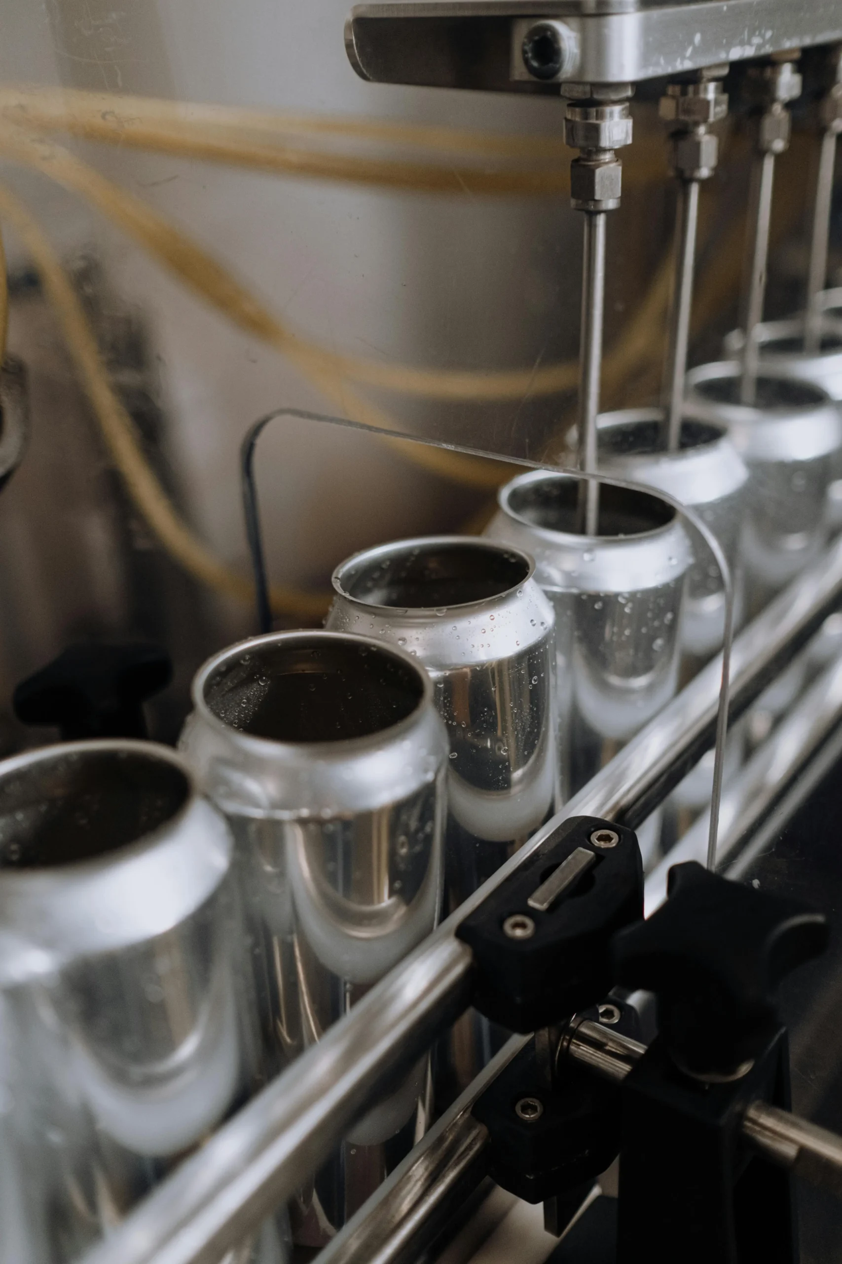 A canning line machine in a brewery assembly area.